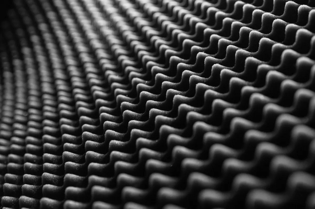 Macro view of viscoelastic constrained layer damping and Mass Loaded Vinyl (MLV) materials.