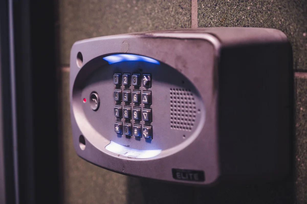 Electronic interlocking airlock door controls with emergency breakout button