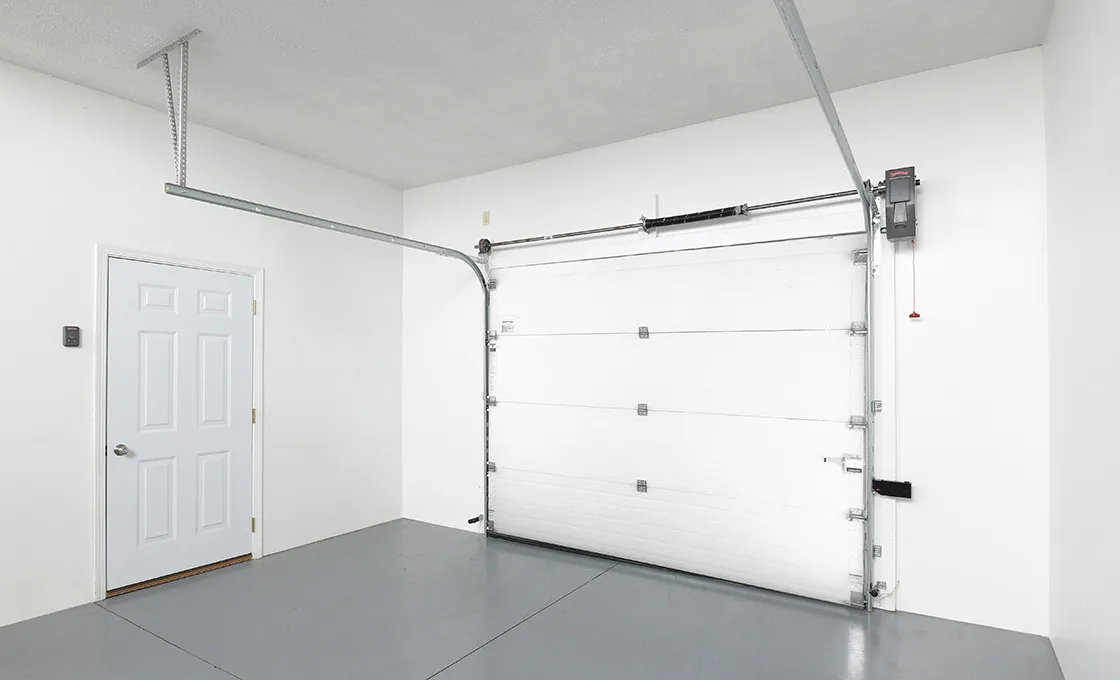 Heavy-duty overhead sectional door securing a commercial warehouse loading bay.