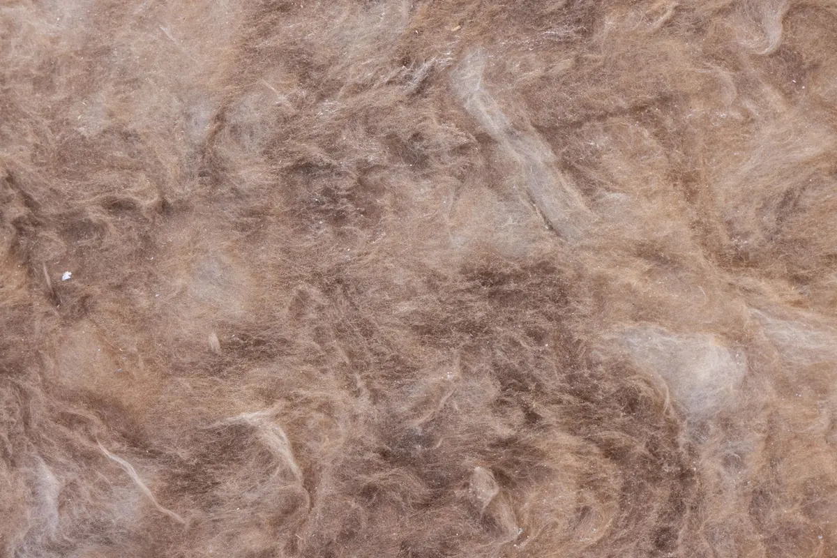 Dense rock mineral wool core material engineered to absorb sound waves and damp mechanical resonance (Source: Pexels)