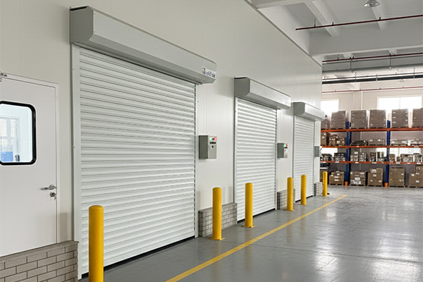 A modern logistics hub seamlessly integrating both aluminum exterior doors and PVC interior roll-up doors.