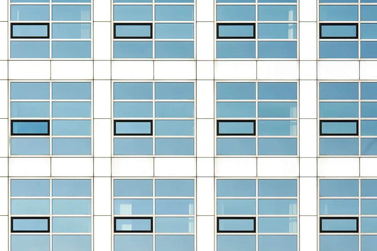 Coplanar double-sided flush cleanroom vision panel glazing and desiccant frame