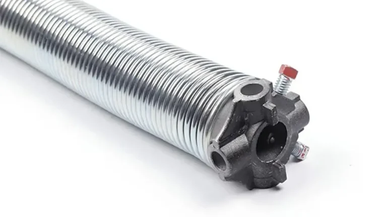 Coiled steel torsion spring hardware for an industrial sectional door