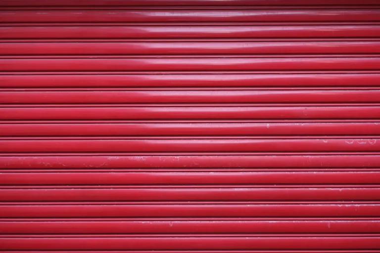 Rigid metal roll-up shutter door on an industrial storage opening