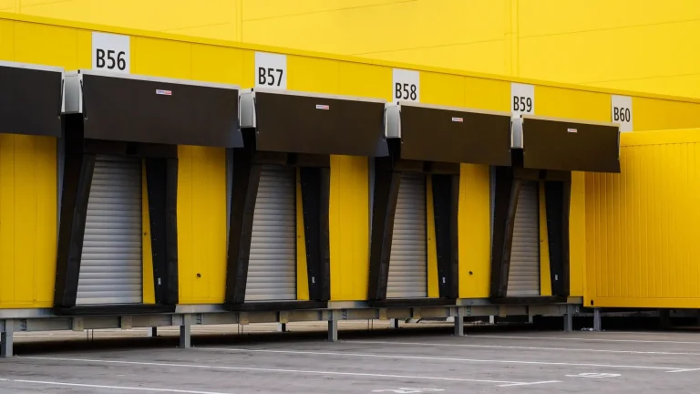 Row of industrial warehouse doors fitted with powered operators