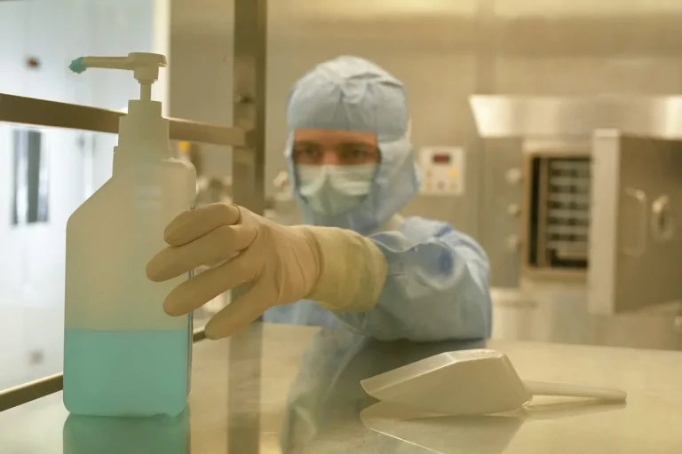 High speed rapid roll up cleanroom barrier door installed in pharmaceutical airlock