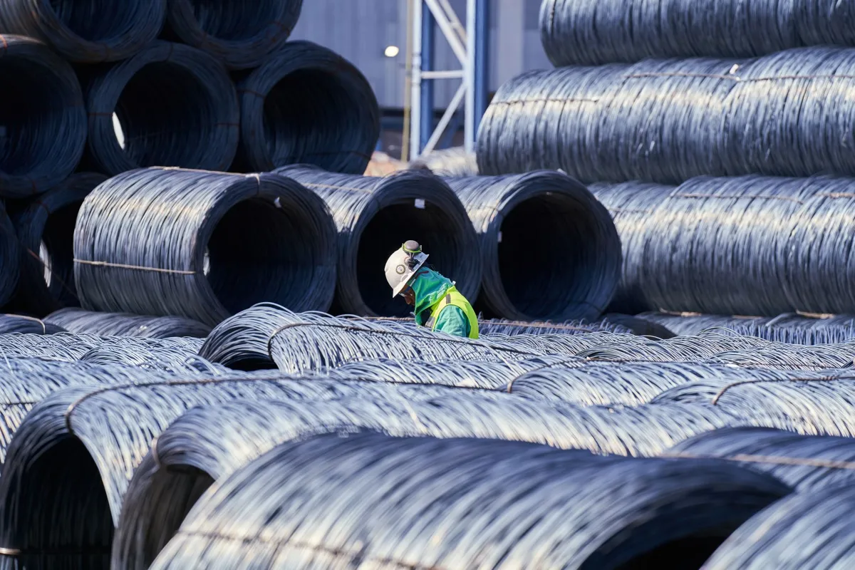 Coiled steel wire bundles stocked for industrial spring manufacturing