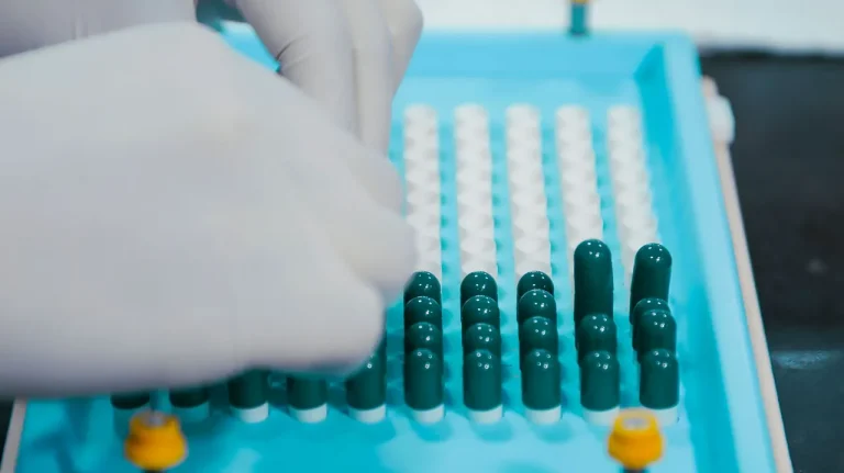 Technician in sterile gear inside a clean room, illustrating industrial clean room vs biological clean room differences